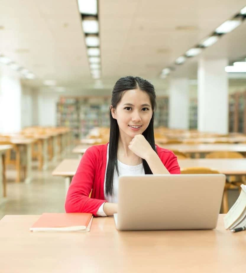 Woman with Laptop for Homepage Assignment Ninja